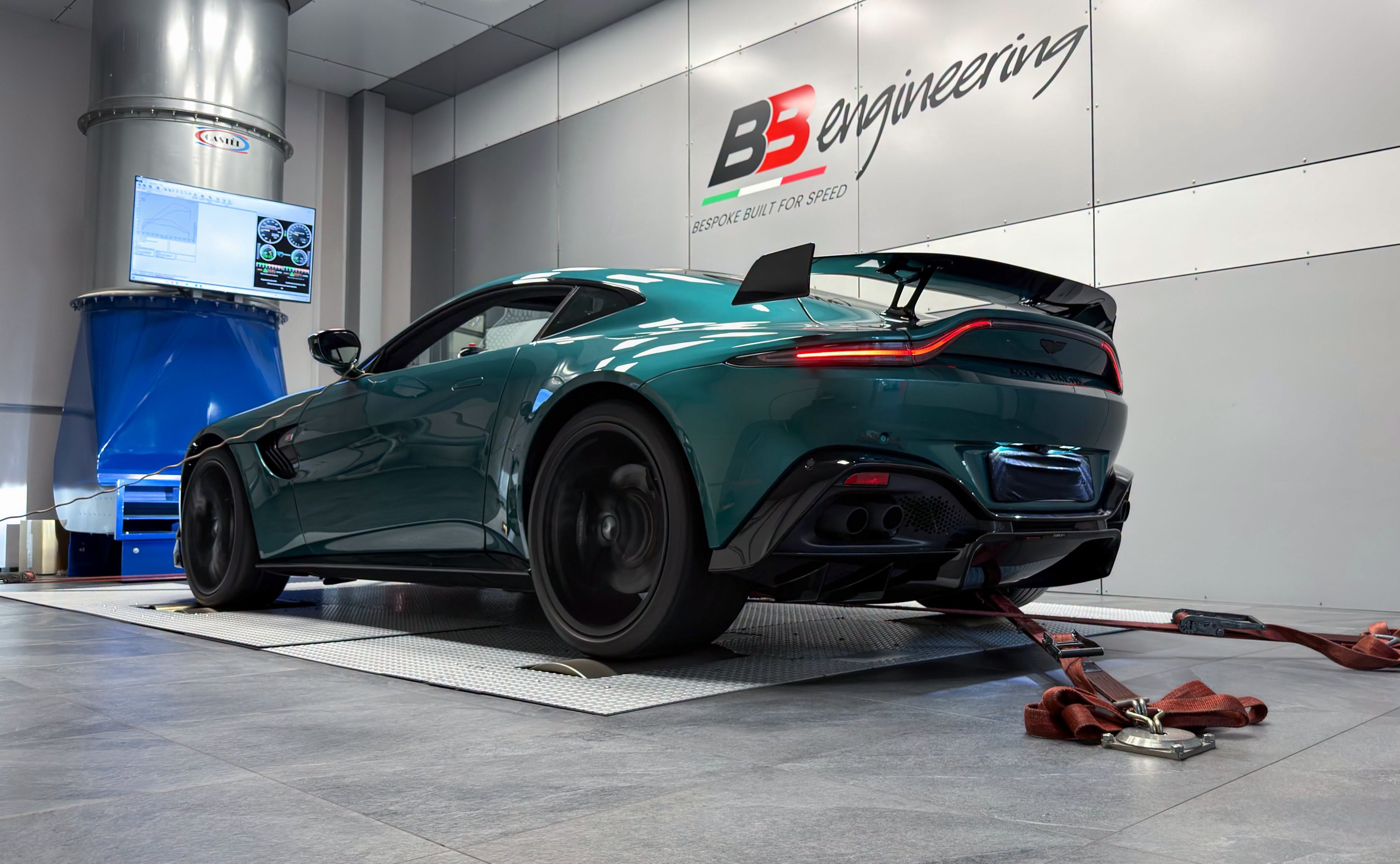 Green Aston Martin Vantage on the dyno with the power curve displayed on the cell monitor