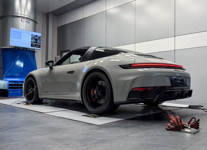 Chalk grey Porsche 911 Targa GTS on the chassis dynamometer